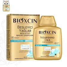 شامپو تقویتکننده و ترمیمکننده مو بیوکسین مدل Nourishing Oils Care حجم 300 میلیلیتر